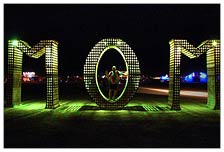 This neon-lit art installation on the playa is a big sign of respect paying homage to mothers everywhere, as well as supporting mother earth.