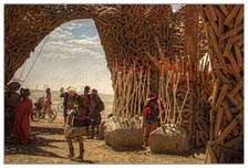 People write tributes, eulogies, and farewells on the bottom of the man before it gets burned. By the end of the week, there's hardly any open space on the wood of the man or the temple.