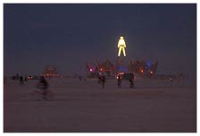 As the afternoon dust storm settles and the sunset fades, lights and flames start flickering, and the energy starts getting revved up. Many people at many camps are finishing up eating dinner, prepping for the thousand different parties on the playa.