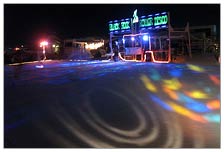 Roller skating floor set up. Hard to see just how big this is but there were times when dozens of skaters were using this, whether for roller derby, roller limbo, trick skating, skate shows, or just open skate times. Lots of fun.